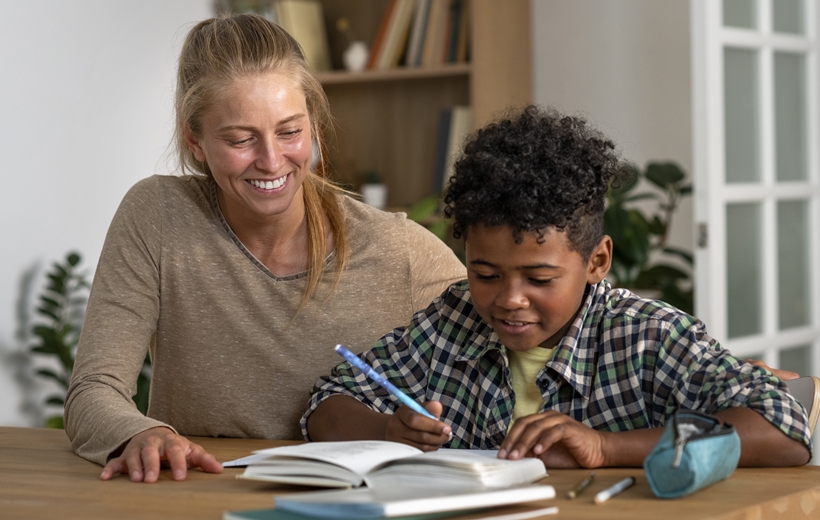 Experienced tutor providing one-on-one academic support to an elementary student.